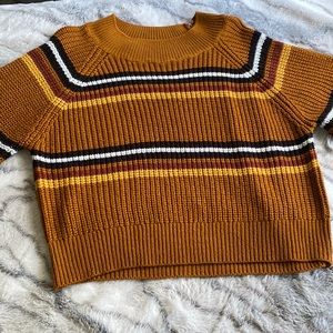 Burn orange knitted sweater with black white red and yellow stripes